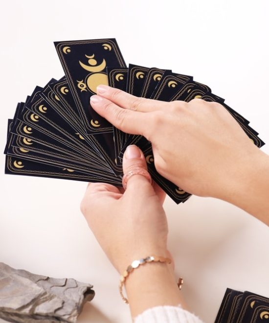 Soothsayer,Predicting,Future,With,Tarot,Cards,At,Table,,Closeup